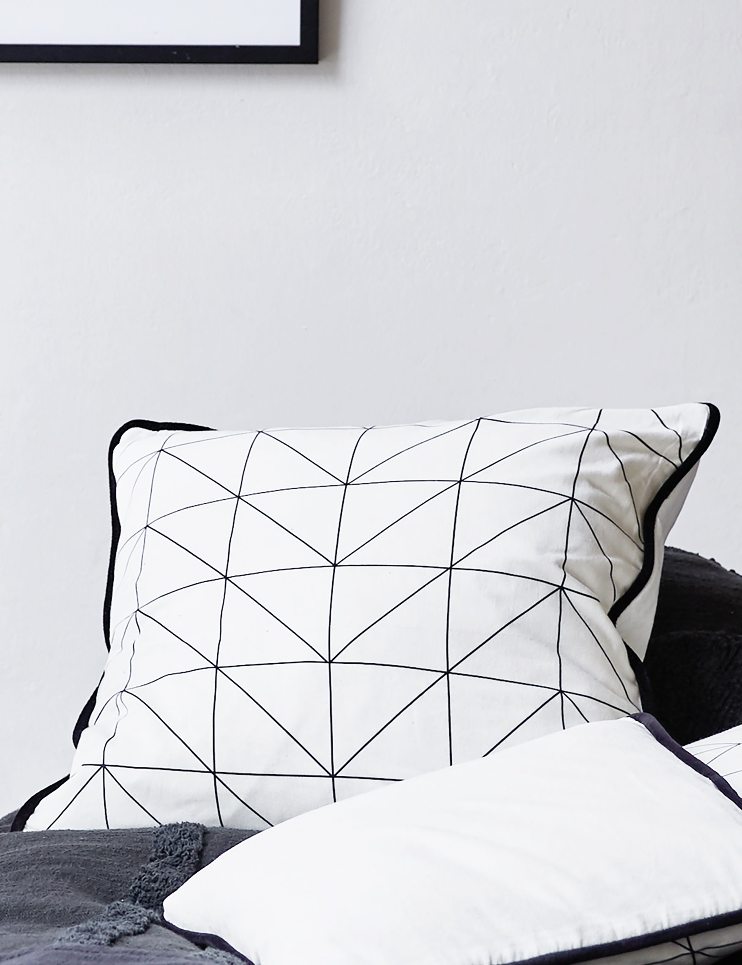 Geometric shop print cushion